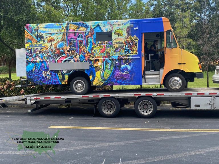 MOVING FOOD TRUCKS ON A FLATBED TRAILER