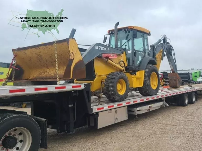 MOVING A CONSTRUCTION EQUIPMENT ON A FLATBED TRAILER