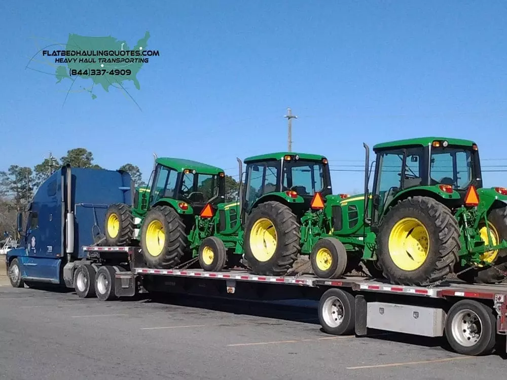 MOVING TRACTORS ON A FLATBED TRAILER