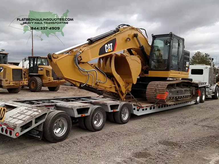 Heavy Haulers MOVING BACKHOE ON FLATBED TRAILER