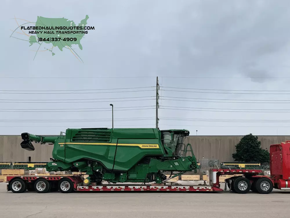 MOVING FARM MACHINERY ON A FLATBED TRAILER